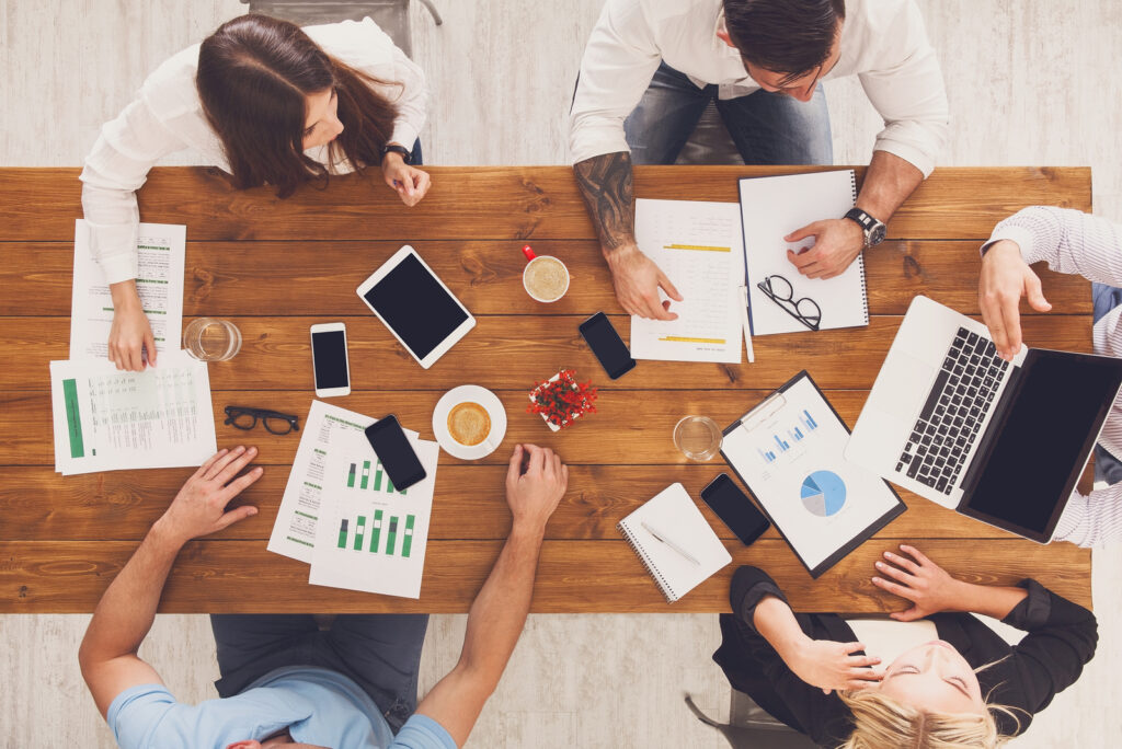 A group of professionals at BDX Omaha brainstorming or working on digital strategies, showcasing the team's expertise and dedication.